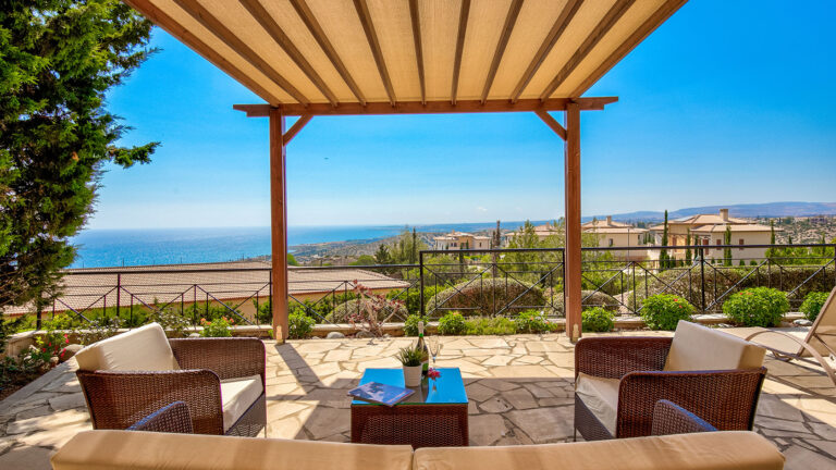 View of the terrace out to sea from Apartment CC02 on Theseus Village, Aphrodite Hills Resort, Cyprus. Presented by Aphroditerentals.com