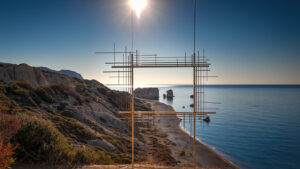 View of Aphrodite's Rock through a metal frame, on Paphos coast.